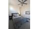 Inviting bedroom featuring soft carpet, ceiling fan, and a comforting aesthetic at 6332 E 142Nd Pl, Thornton, CO 80602