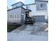 Modern two-story home with a two-car garage and stylish gray and white exterior at 6332 E 142Nd Pl, Thornton, CO 80602