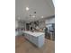 Bright kitchen with gray cabinets, stainless steel appliances, and a center island at 6332 E 142Nd Pl, Thornton, CO 80602