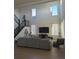Open-concept living room with high ceilings and a large comfortable gray couch at 6332 E 142Nd Pl, Thornton, CO 80602