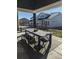 Outdoor dining area with stylish furniture for entertaining, set in a landscaped backyard at 6332 E 142Nd Pl, Thornton, CO 80602