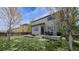 Green backyard with a concrete patio, perfect for outdoor entertaining at 961 Stanley Ct, Erie, CO 80516