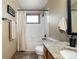 This bathroom features a tiled shower and granite counter, offering a clean and functional space at 13452 Riley Peak Rd, Conifer, CO 80433