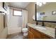 Bathroom featuring tile floors, a tub and shower, and a granite countertop on the wooden vanity at 13452 Riley Peak Rd, Conifer, CO 80433