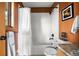 Cozy bathroom with a combined shower and tub, along with charming accents at 13452 Riley Peak Rd, Conifer, CO 80433