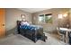 Bedroom is designed with a bed, drawers, and large windows that offer great views of the outdoors at 13452 Riley Peak Rd, Conifer, CO 80433