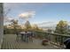 Outdoor deck area showcasing a dining set and scenic mountain views beyond the railing at 13452 Riley Peak Rd, Conifer, CO 80433
