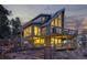 Stunning exterior view of a mountain home featuring beautiful decks and lush trees at 13452 Riley Peak Rd, Conifer, CO 80433