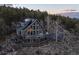 Beautiful home with decks and solar panels nestled in a serene mountain setting at 13452 Riley Peak Rd, Conifer, CO 80433