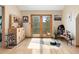 Bright yoga room with hardwood floors, natural light, and sliding doors leading to an outdoor space at 13452 Riley Peak Rd, Conifer, CO 80433