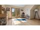 Bright yoga room with hardwood floors, natural light, and sliding doors leading to an outdoor space at 13452 Riley Peak Rd, Conifer, CO 80433