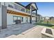Spacious backyard features a stone patio and a grill at 3293 Offbeaten Pl, Castle Rock, CO 80108
