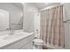 Clean bathroom features a shower over tub with neutral tile and a modern vanity at 3293 Offbeaten Pl, Castle Rock, CO 80108