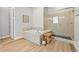 Bright bathroom featuring a separate tub and walk in shower at 3293 Offbeaten Pl, Castle Rock, CO 80108