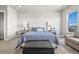 Cozy bedroom with a padded headboard, soft lighting, and comfortable seating at 3293 Offbeaten Pl, Castle Rock, CO 80108