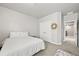 Bedroom features neutral carpet, double closet and adjacent bathroom access at 3293 Offbeaten Pl, Castle Rock, CO 80108