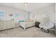 Bright bedroom features white furniture, neutral walls, and soft natural light at 3293 Offbeaten Pl, Castle Rock, CO 80108