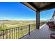 Spacious deck offers amazing mountain views and seating at 3293 Offbeaten Pl, Castle Rock, CO 80108