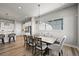 Bright dining room featuring modern furnishings and a view of the outdoor scenery at 3293 Offbeaten Pl, Castle Rock, CO 80108