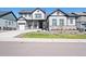 Charming two-story home with a well-manicured lawn and inviting curb appeal at 3293 Offbeaten Pl, Castle Rock, CO 80108