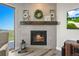 Cozy fireplace with a decorative mantle, creating a warm and inviting atmosphere at 3293 Offbeaten Pl, Castle Rock, CO 80108