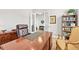 Office space featuring a classic wood desk, leather chair, and built-in bookcase at 3293 Offbeaten Pl, Castle Rock, CO 80108