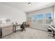 Bright home office with natural light, stylish desk, and views of the outdoors at 3293 Offbeaten Pl, Castle Rock, CO 80108