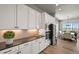 Elegant kitchen with white cabinets, stainless steel appliances, and sleek countertops at 3293 Offbeaten Pl, Castle Rock, CO 80108