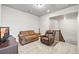 Cozy upstairs living room featuring comfortable seating and neutral carpeting at 3293 Offbeaten Pl, Castle Rock, CO 80108