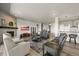 Open-concept living room featuring a fireplace, and hardwood flooring at 3293 Offbeaten Pl, Castle Rock, CO 80108