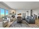 Stylish living room featuring a fireplace, comfortable seating, and sliding glass door at 3293 Offbeaten Pl, Castle Rock, CO 80108