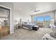 Spacious main bedroom with a cozy sitting area and large windows offering scenic views at 3293 Offbeaten Pl, Castle Rock, CO 80108