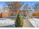 Ranch style home with covered porch and fenced yard at 1673 Nome St, Aurora, CO 80010