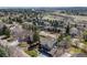 Suburban aerial view of a home on a large lot with a winding creek in a planned community at 2162 Terraridge Dr, Highlands Ranch, CO 80126