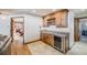 Home bar area features wine storage, custom cabinetry, marble countertop, and wine refrigerator at 2162 Terraridge Dr, Highlands Ranch, CO 80126