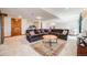 Finished basement boasts a large sectional sofa and recreational equipment, ideal for Gathering entertainment at 2162 Terraridge Dr, Highlands Ranch, CO 80126