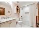 Charming bathroom with subway tile, a shower-tub combo, and marble countertop vanity at 2162 Terraridge Dr, Highlands Ranch, CO 80126