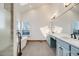 Bright bathroom featuring a soaking tub, walk-in shower, and vanity at 2162 Terraridge Dr, Highlands Ranch, CO 80126
