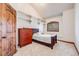 Cozy bedroom features vaulted ceilings, a single bed, and a classic wooden chest of drawers at 2162 Terraridge Dr, Highlands Ranch, CO 80126
