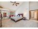 Spacious bedroom featuring vaulted ceilings, a ceiling fan, and ample closet space at 2162 Terraridge Dr, Highlands Ranch, CO 80126
