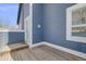 Exterior view of a weathered wood deck with blue wood siding, white trim, and a view of the sky at 2162 Terraridge Dr, Highlands Ranch, CO 80126