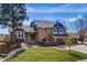 Charming two-story home features a manicured lawn, three car garage and tasteful landscaping at 2162 Terraridge Dr, Highlands Ranch, CO 80126