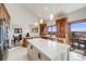 Modern kitchen with center island, stone countertops, wood cabinets, and stainless steel appliances at 2162 Terraridge Dr, Highlands Ranch, CO 80126