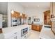 Open-concept kitchen with a large center island, stainless steel appliances and modern white countertops at 2162 Terraridge Dr, Highlands Ranch, CO 80126