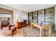 Well-lit office with wood floors, built-in shelving, and a large desk for remote working at 2162 Terraridge Dr, Highlands Ranch, CO 80126