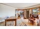 Inviting home office features hardwood floors, french doors, and a cozy leather armchair with a view at 2162 Terraridge Dr, Highlands Ranch, CO 80126