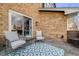 Outdoor patio with comfortable seating and a view of the landscaped backyard, perfect for relaxation at 2162 Terraridge Dr, Highlands Ranch, CO 80126