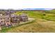 Aerial view of the fenced backyard, the deck, and the surrounding neighborhood at 2511 Loon Ln, Castle Rock, CO 80104