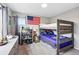 Bedroom featuring a bunk bed, American flag decor, dresser, and carpeted floor at 2511 Loon Ln, Castle Rock, CO 80104