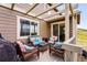 Cozy deck with wicker furniture, a grill, and views of the surrounding landscape at 2511 Loon Ln, Castle Rock, CO 80104
